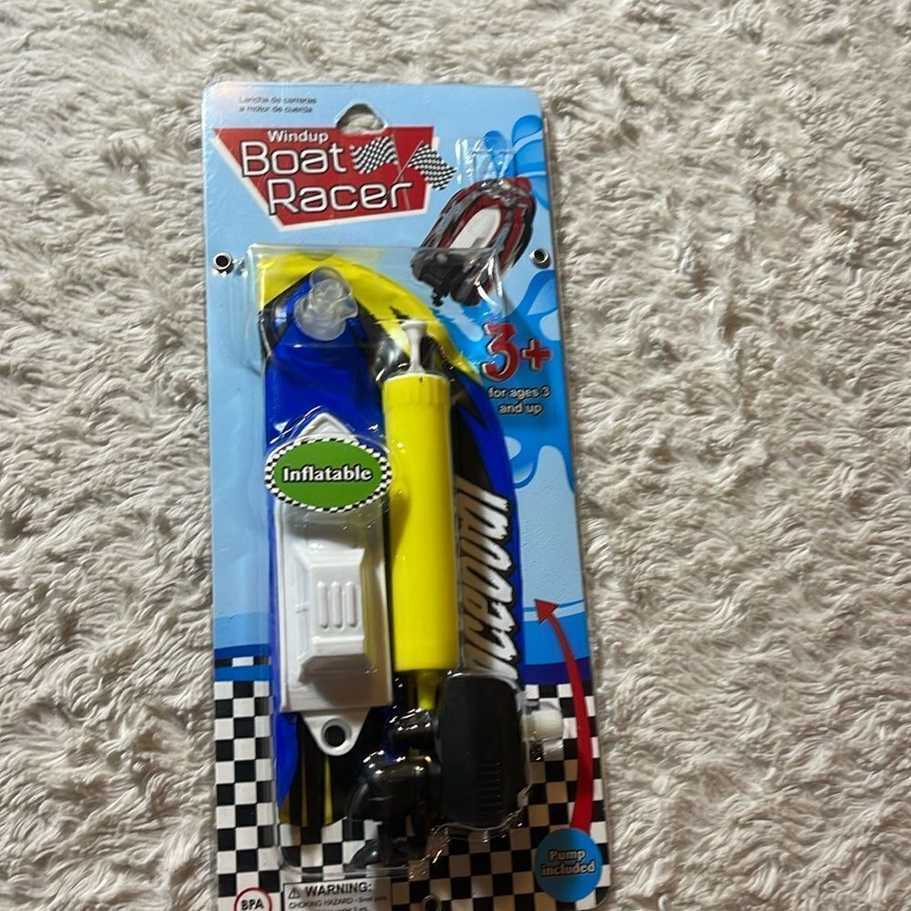 Vintage wind up boat racer toy